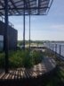 Circular rooftop garden with with 6 trees and 2,000 plants, as well as 712 solar panels and 58 smart sensors and a water buffer